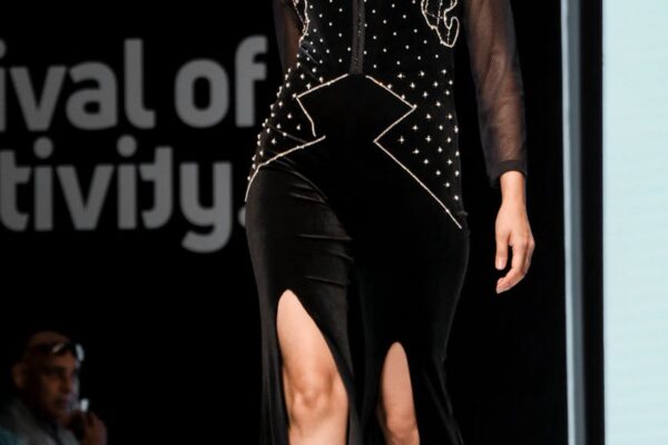 photo of runway model modelling a black outfit
