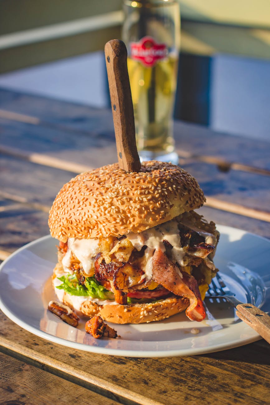 knife on burger on a salad plate
